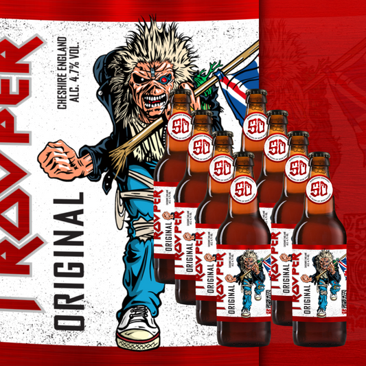 Eight bottles of Trooper Original Ale 500ml with limited edition 50th anniversary labels, displayed in front of Eddie artwork and red flag background.
