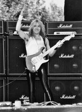 Load the picture into the gallery viewer, Dave Murray of Iron Maiden performing live in front of stacked Marshall amplifiers.
